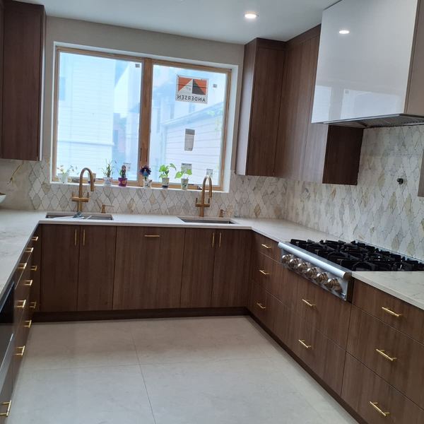 Walnut kitchen with gold hardware by CABINX